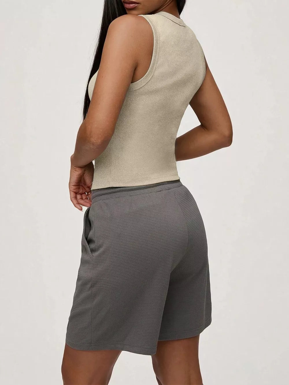 Ribbed Khaki tank top with button front detail, fitted silhouette.