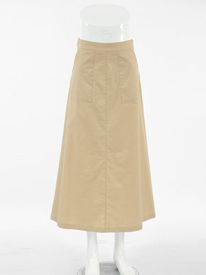 High-waisted A-line skirt in tan cotton with two front pockets.
