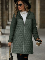 Army green teddy and quilted hybrid coat with a hood and zipper front.