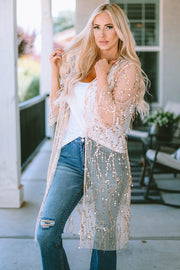 Beige sequin duster with flared sleeves and open front, styled with a white tank and jeans.