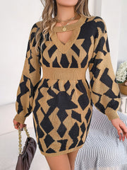 Geometric cutout knit mini dress in Khaki with black pattern, V-neck, long sleeves, and cinched waist.
