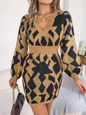 Geometric cutout knit mini dress in Khaki with black pattern, V-neck, long sleeves, and cinched waist.