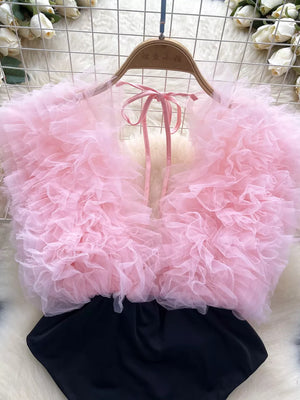 Pink ruffled V-neck bodysuit with lace detail and tie back.