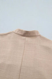 Luxe crochet lace pullover in beige with rolled sleeves and a band collar detail.