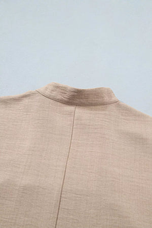 Luxe crochet lace pullover in beige with rolled sleeves and a band collar detail.