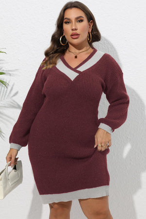 Burgundy ribbed knit v-neck dress with contrast trim details and long sleeves.