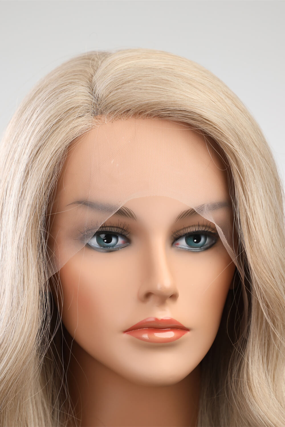 Blonde lace front wig with natural hairline and beachy waves.