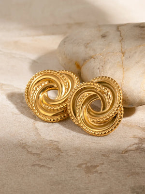 Gold swirl knot stud earrings with textured rope edge detail