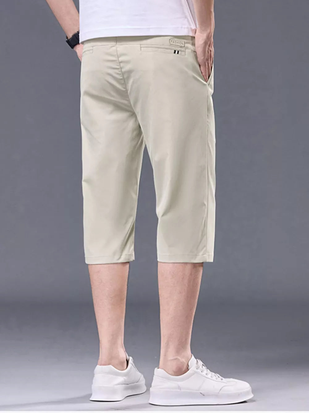 Apricot chino shorts for men with belt loops and pockets.