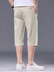 Apricot chino shorts for men with belt loops and pockets.