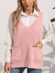 Oversized dusty pink knit vest with V-neck and patch pockets, styled over a white shirt.