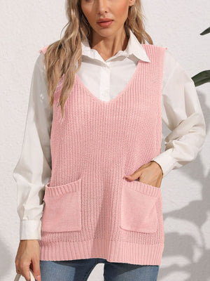 Oversized dusty pink knit vest with V-neck and patch pockets, styled over a white shirt.