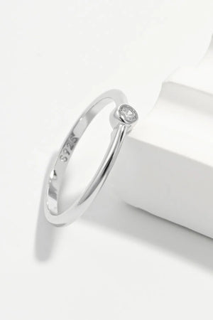 Solitaire silver ring with zirconia, 925 sterling silver band, minimalist design.