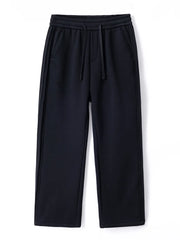 Black relaxed fit men's sweatpants with drawstring and side stripe detail.