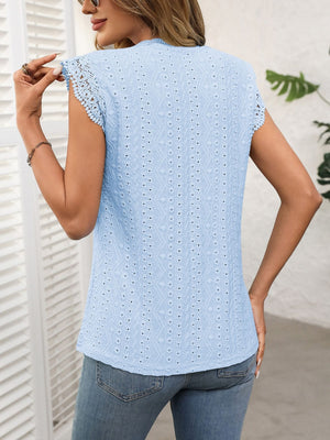 Light blue eyelet cap sleeve blouse with lace trim on sleeves.