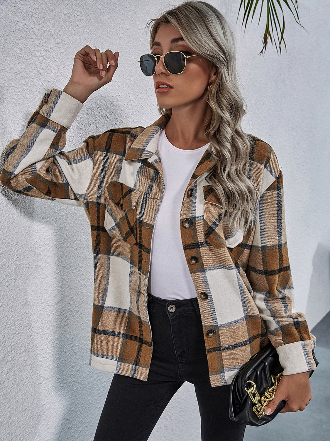 Checkered collared jacket in tan and white with button front and chest pockets.