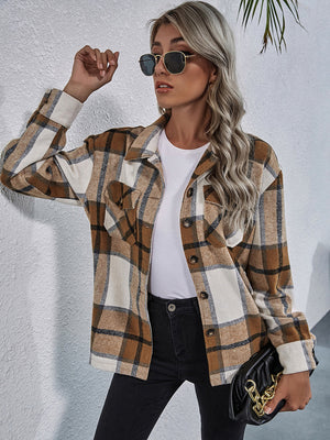 Checkered collared jacket in tan and white with button front and chest pockets.