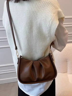 Brown ruched crossbody bag with braided strap detail