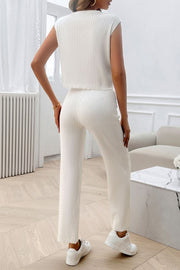 White ribbed knit cropped lounge set with sleeveless top and wide leg pants.