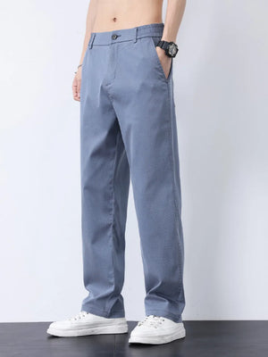 Relaxed fit light blue casual pants with subtle texture and elastic waistband.