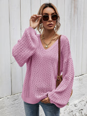 Open-knit balloon sleeve sweater in Moonlit Mauve with a V-neck and textured stitch detail.