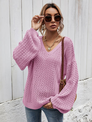 Open-knit balloon sleeve sweater in Moonlit Mauve with a V-neck and textured stitch detail.