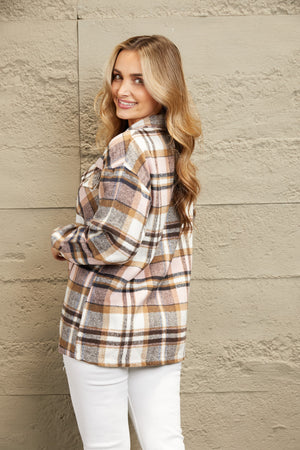 Soft plaid shacket in pink and brown with patch pockets and button details.