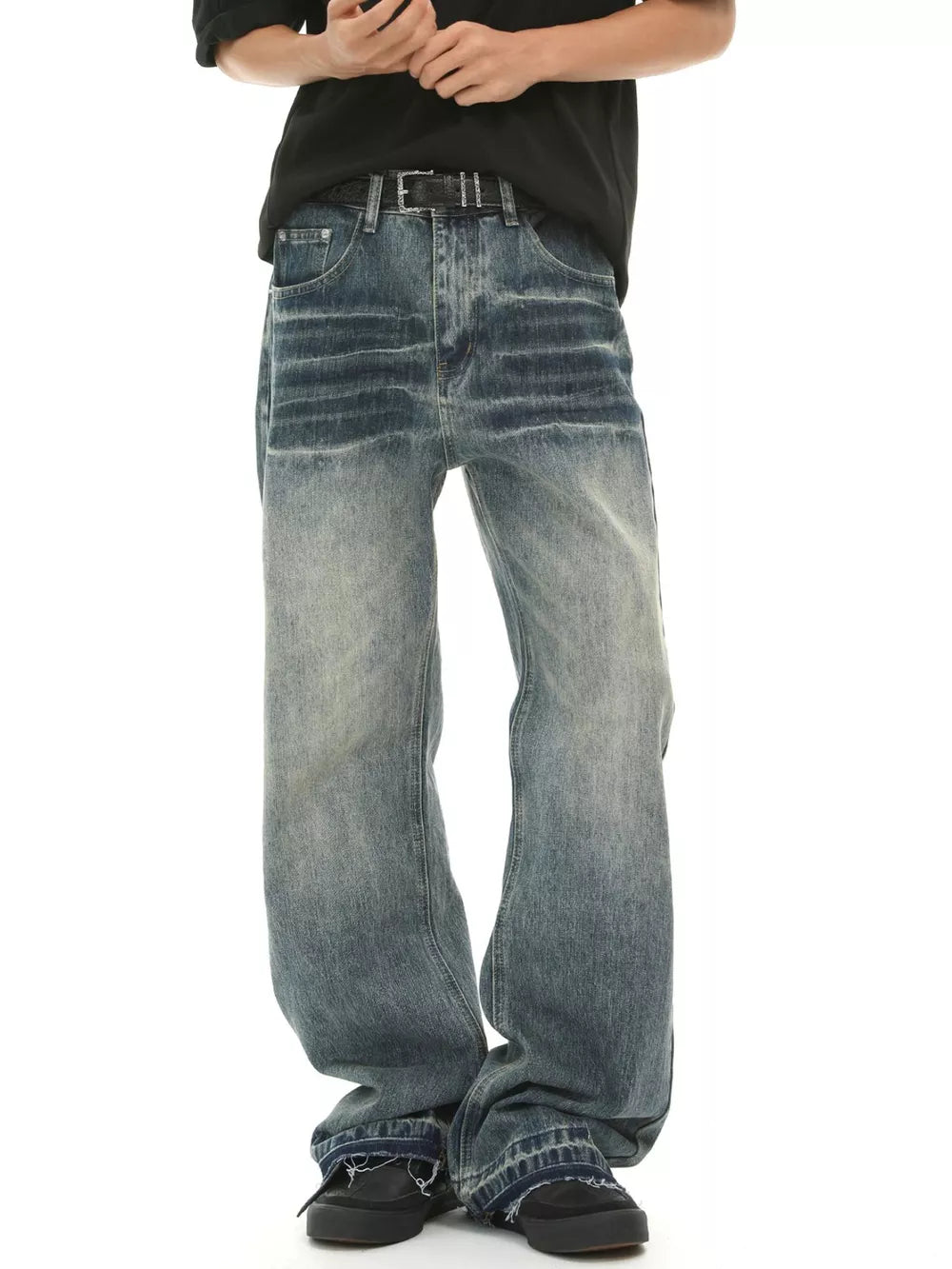 Men's loose fit vintage wash blue denim jeans with a baggy cut.