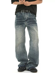 Men's loose fit vintage wash blue denim jeans with a baggy cut.