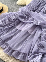Purple tiered tulle skirt with ruffled hem and lining, shown from below.