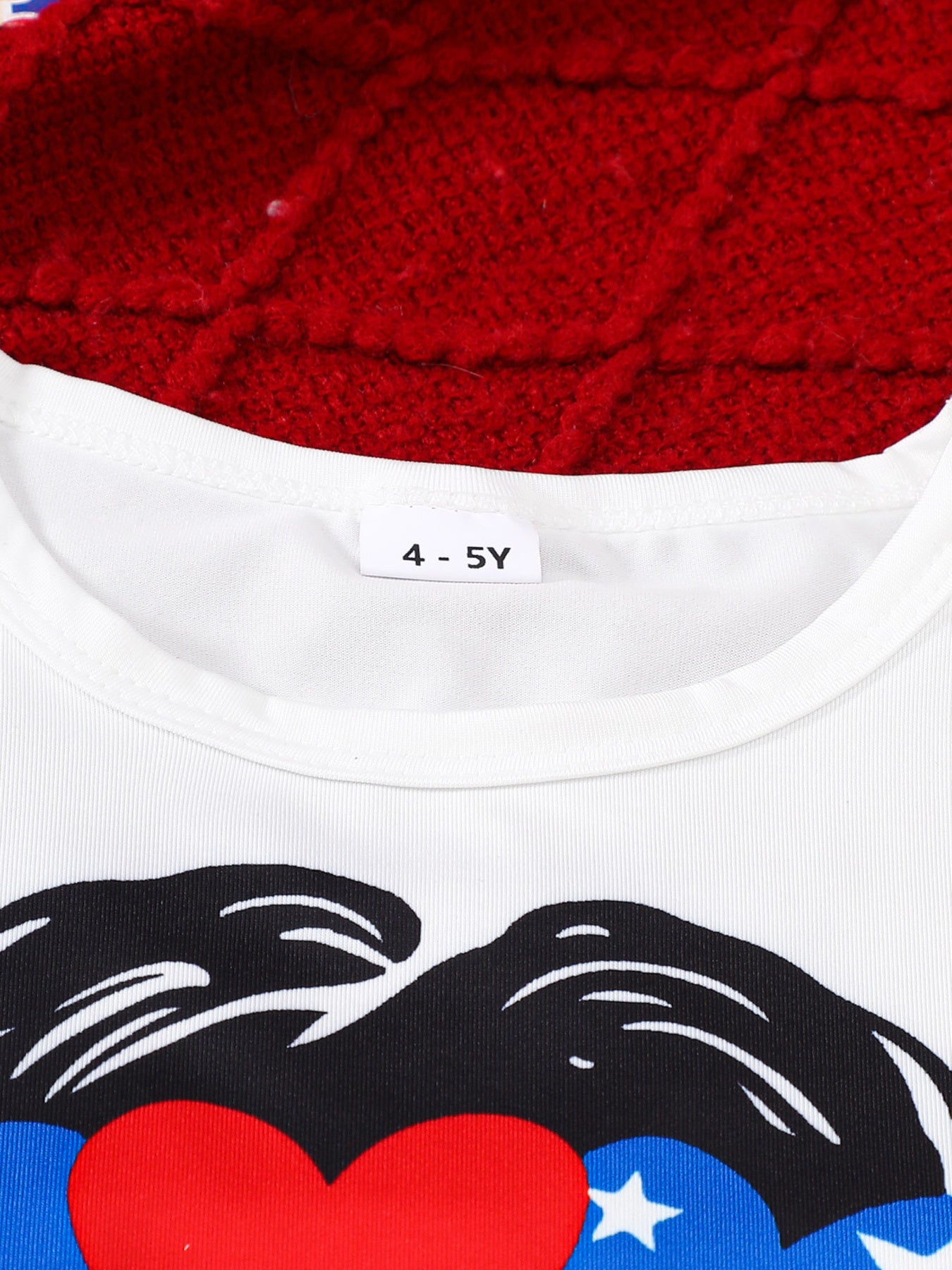 White cotton baby t-shirt with patriotic graphic print and size tag 4-5Y.