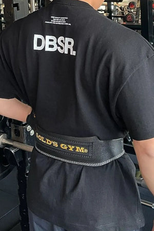 Black oversized tee with white DBSR back print and small text detail.