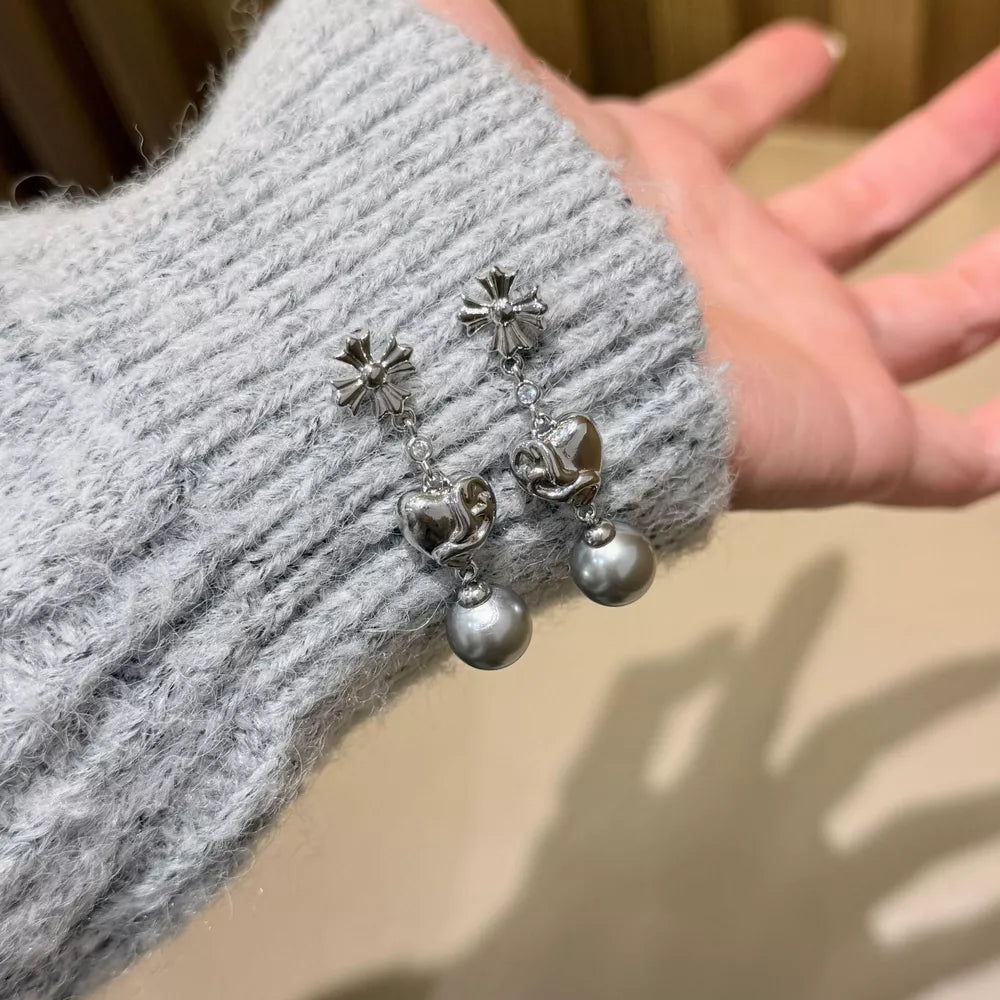 Sophisticated pearl heart drop earrings in gray with silver-tone metal accents.