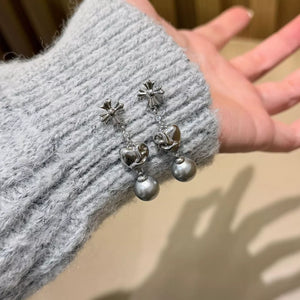Sophisticated pearl heart drop earrings in gray with silver-tone metal accents.