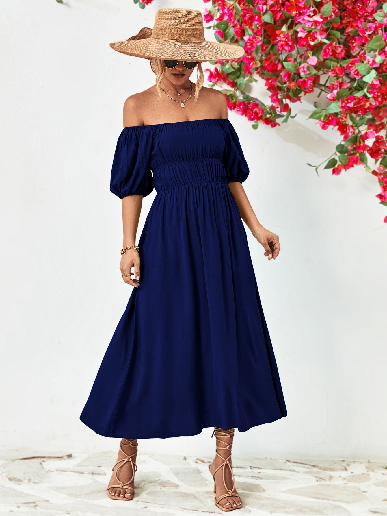 Dark blue off-shoulder midi dress with gathered bodice and balloon sleeves, A-line skirt.