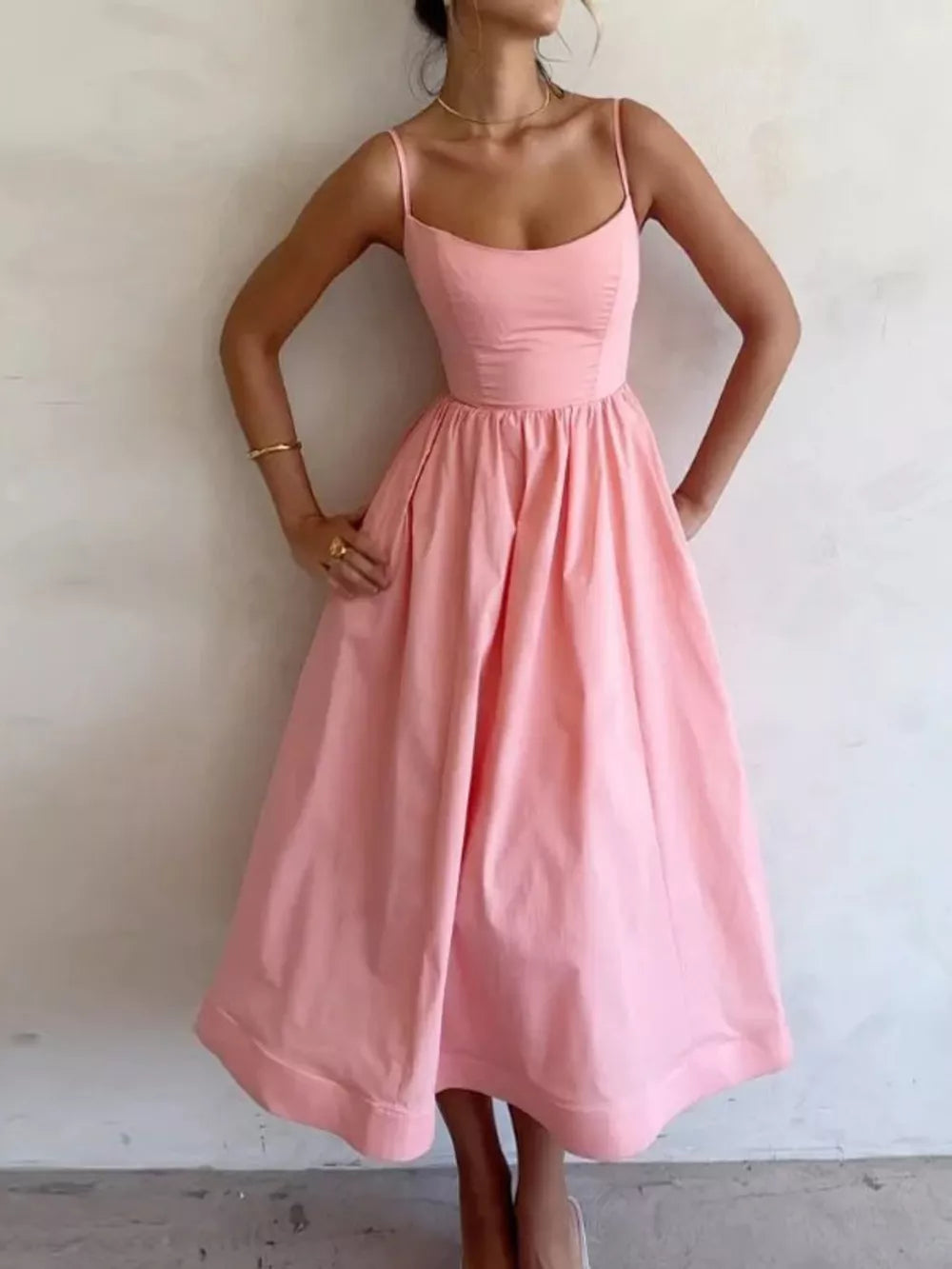 Blush pink midi dress with adjustable straps and a-line skirt