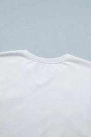 White cotton maternity tee with notched neckline and star applique detail.