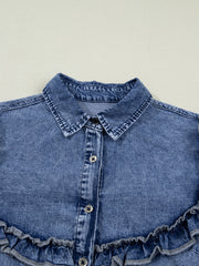 Vintage wash denim button-down shirt with ruffled hem and button front detail.