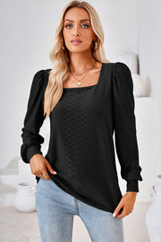 Black diamond-textured blouse with square neckline and puff sleeves