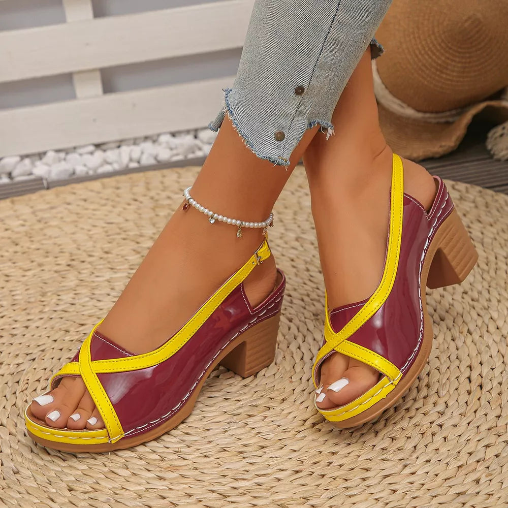 Burgundy and yellow open-toe block heel sandals with crisscross straps and adjustable ankle strap.