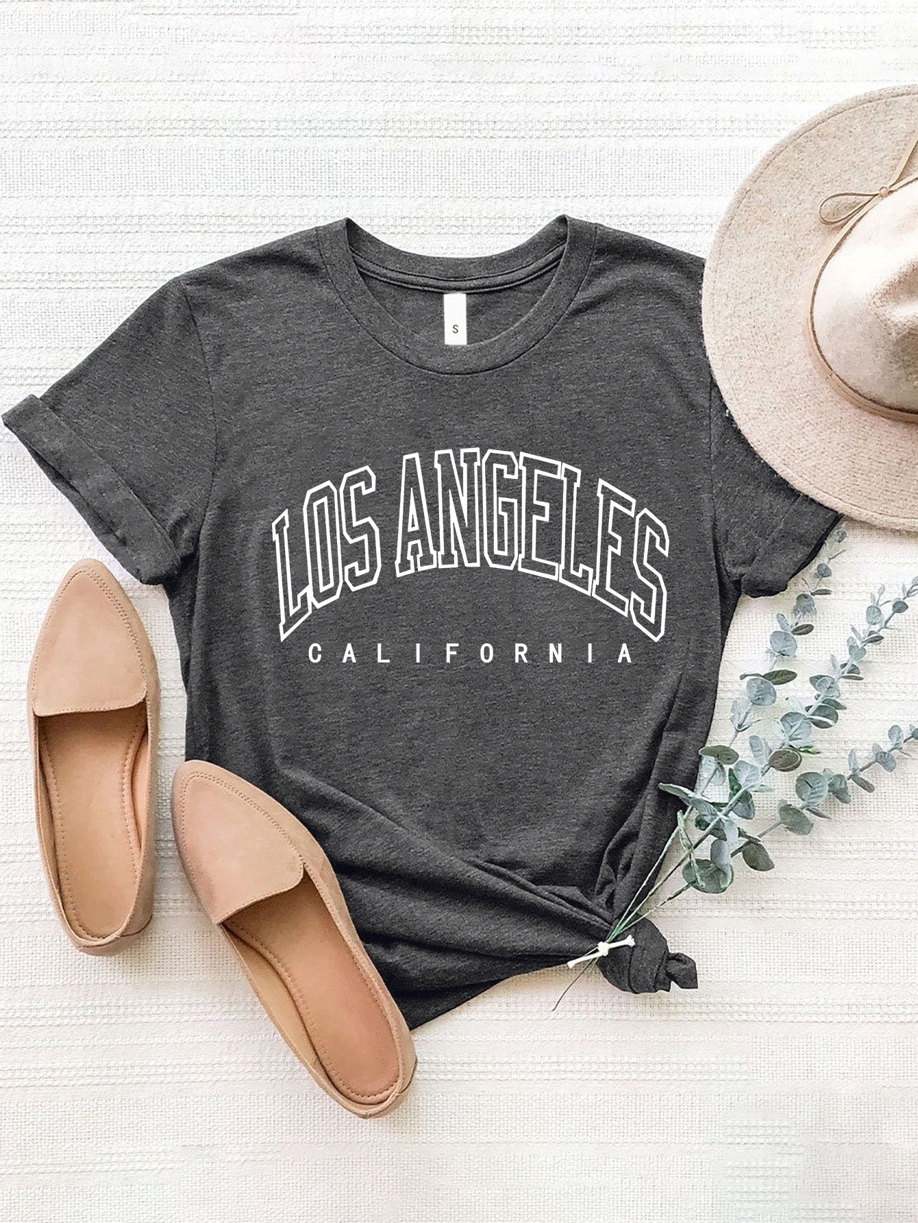 Gray graphic t-shirt with Los Angeles California text, 100% polyester, short sleeves