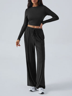 Black ribbed knit long sleeve crop top and drawstring wide leg pants set.