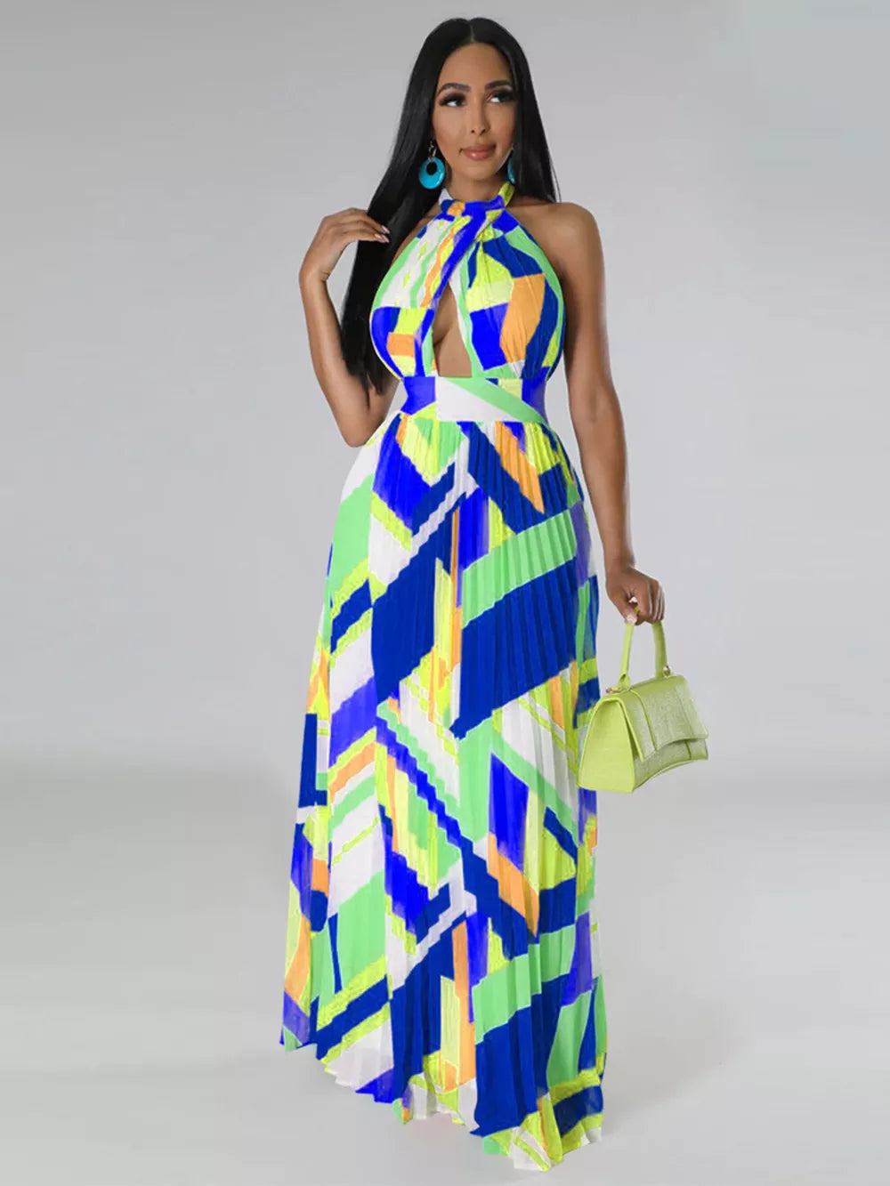 Halter neck maxi dress with bold geometric print, keyhole cutout, defined waistband, and pleated skirt.