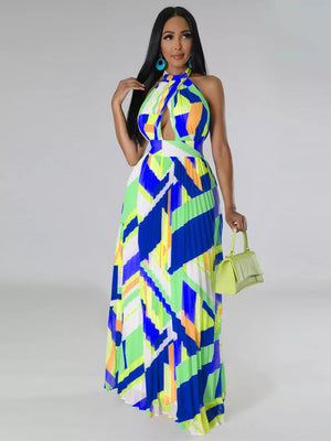 Halter neck maxi dress with bold geometric print, keyhole cutout, defined waistband, and pleated skirt.