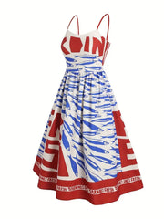 Spaghetti strap midi dress with blue sardines and red text print.
