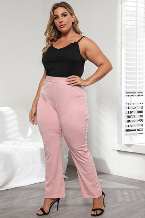 Dusty pink flare leg trousers with sculpted seams and a ruched side detail.
