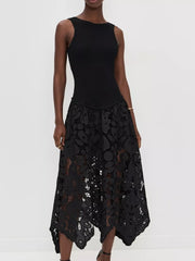 Black midi dress with crochet lace skirt and cutout details.