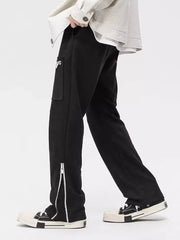 Black relaxed fit sweatpants with cargo pocket and ankle zippers