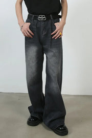 Black faded wash pleated palazzo jeans with a wide leg and a relaxed fit.