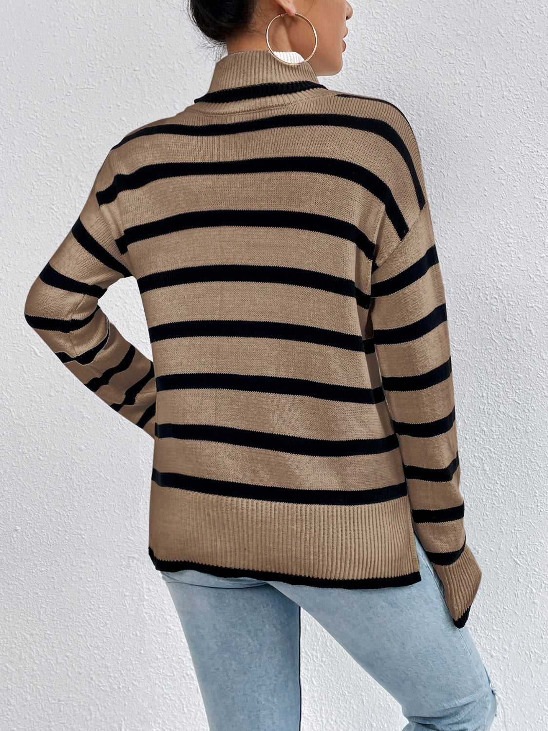 Oversized camel and black stripe turtleneck sweater with ribbed cuffs and hem.